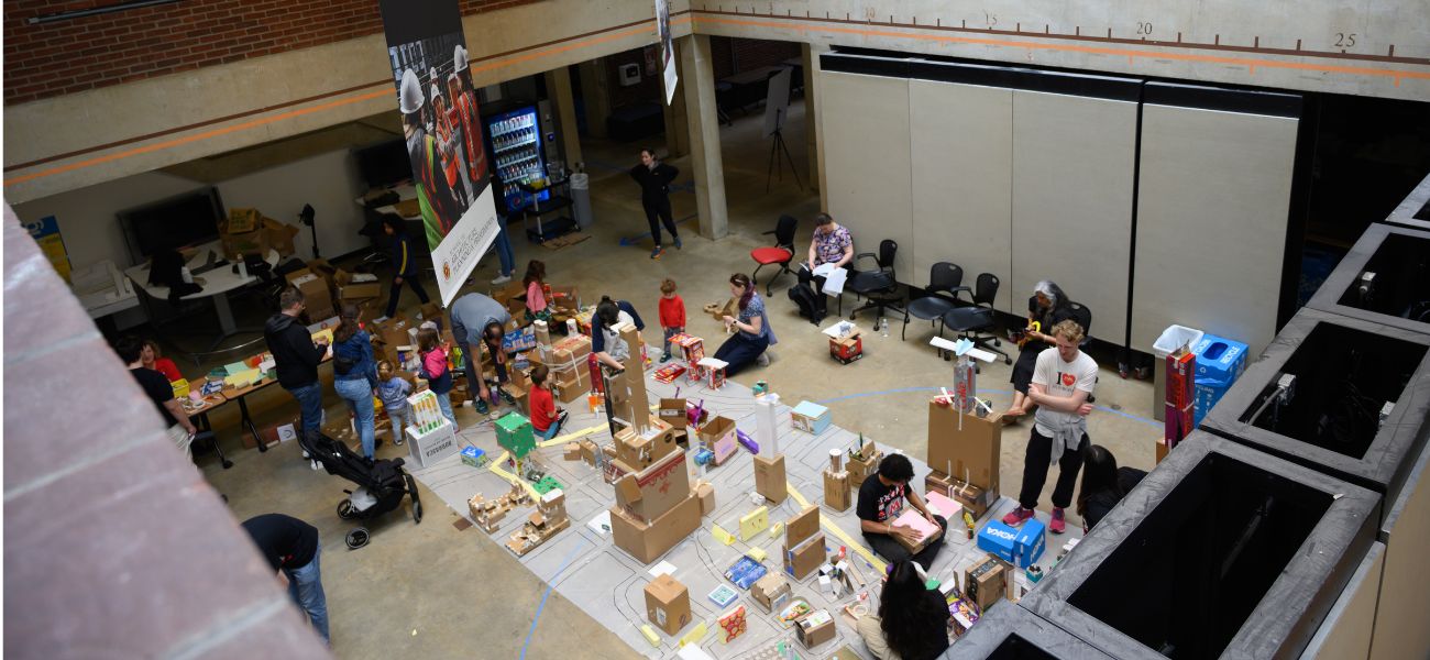 Students building with boxes